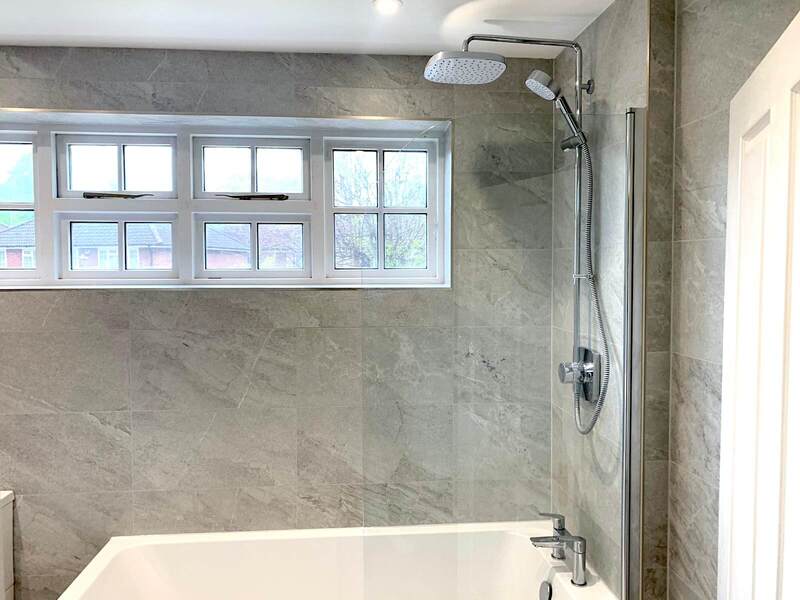 Close-up of grey tiled bathtub in St Albans bathroom renovation by St Albans Bathroom Fitters
